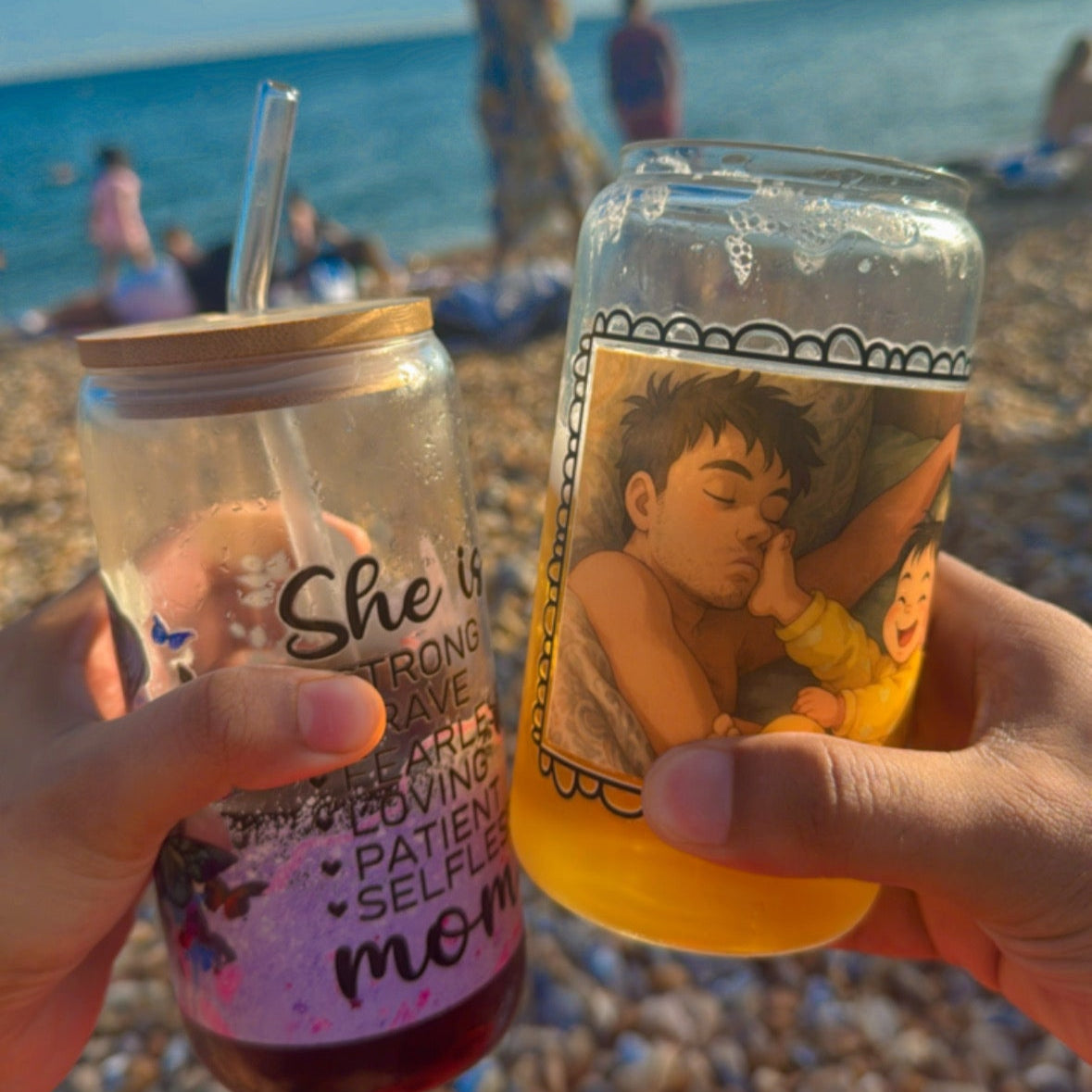 Two hands holding drinks with beach background