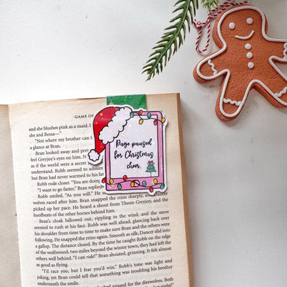 Page paused for Christmas Cheer Santa Cap Magnetic Bookmark: Book Lover Gift