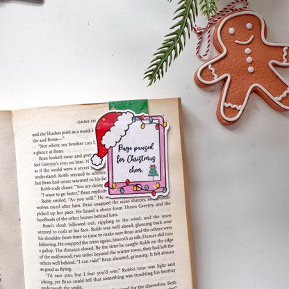Page paused for Christmas Cheer Santa Cap Magnetic Bookmark: Book Lover Gift