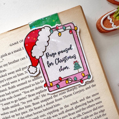 Page paused for Christmas Cheer Santa Cap Magnetic Bookmark: Book Lover Gift