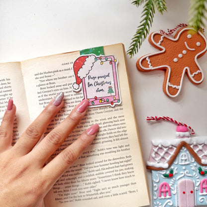 Page paused for Christmas Cheer Santa Cap Magnetic Bookmark: Book Lover Gift