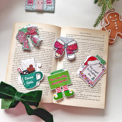 Page paused for Christmas Cheer Santa Cap Magnetic Bookmark: Book Lover Gift