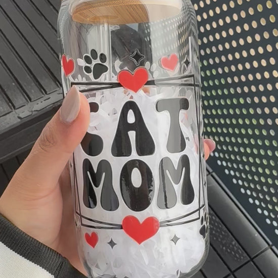 video of cat mom glass can